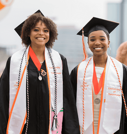 Two peers at their Tennessee graduation ceremony